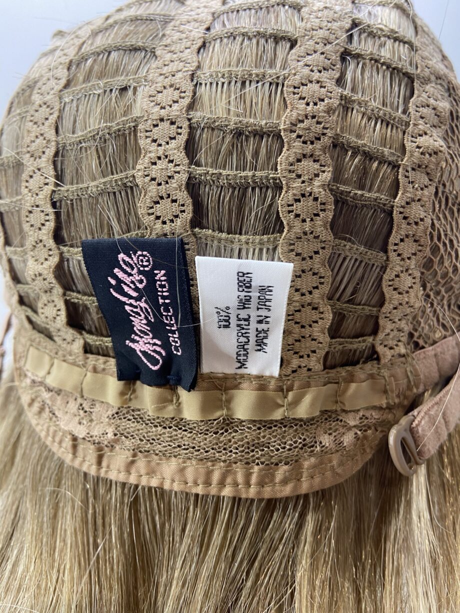 Blonde highlighted mid length wig. Blms590