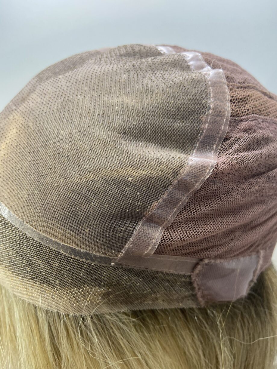Rooted soft cap blonde wig.