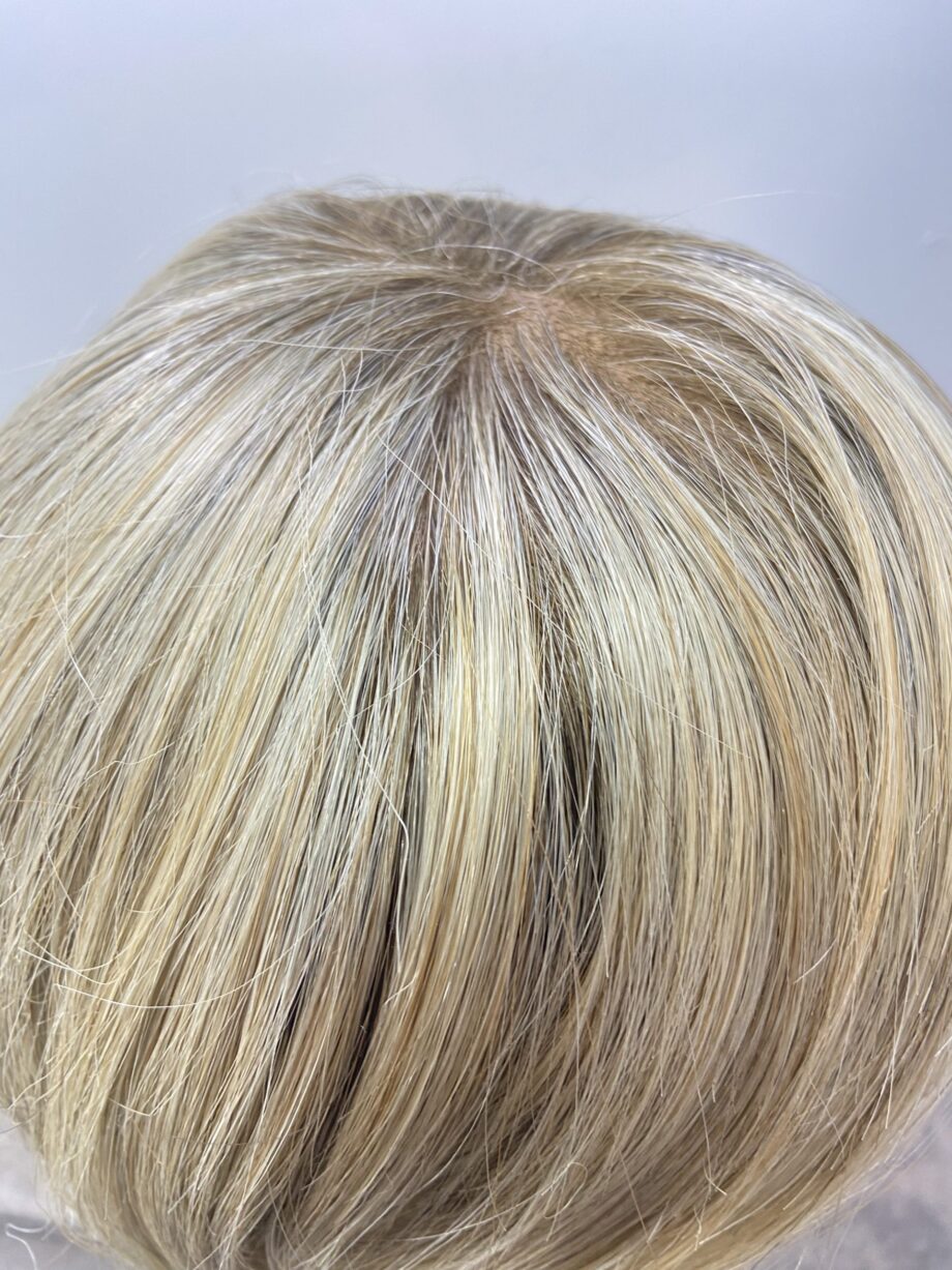Rooted soft cap blonde wig.