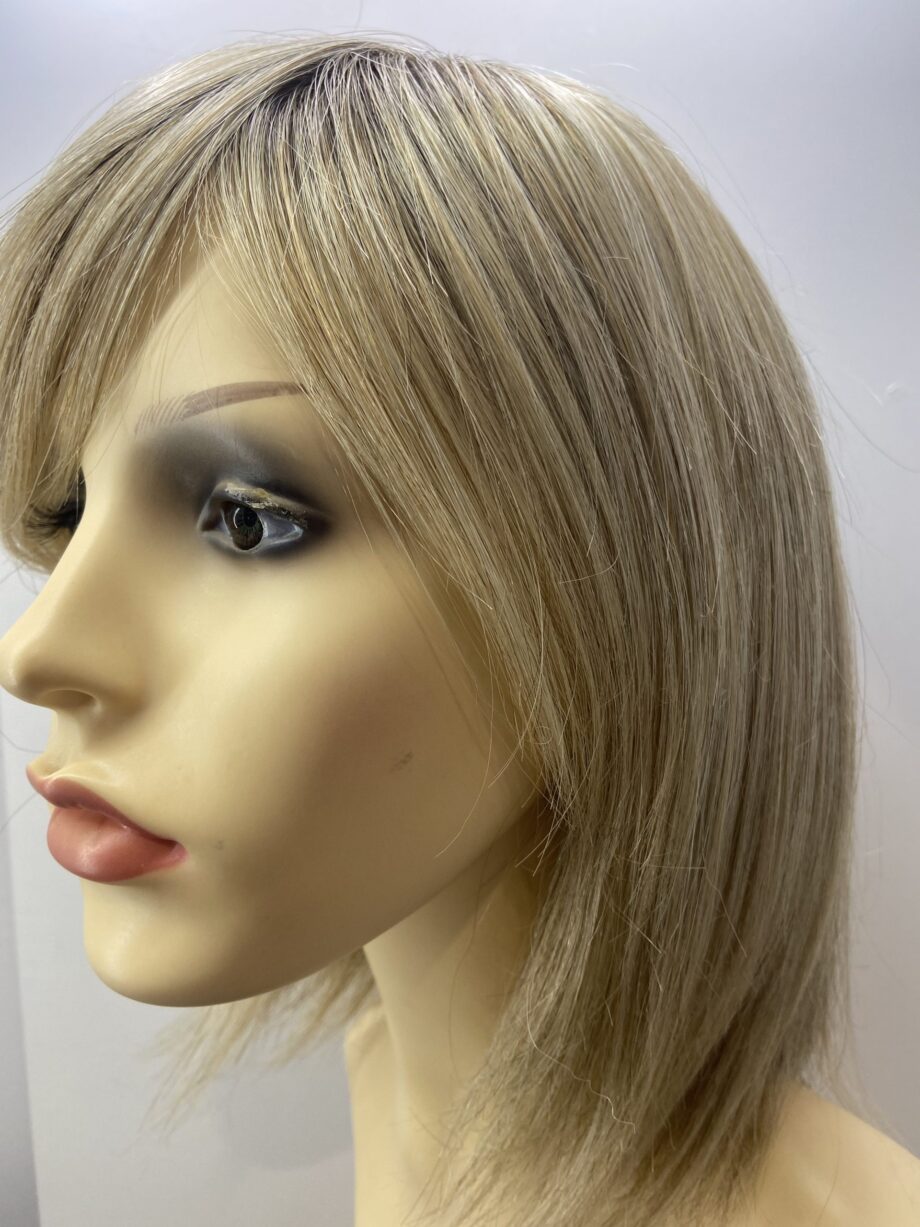Rooted soft cap blonde wig.