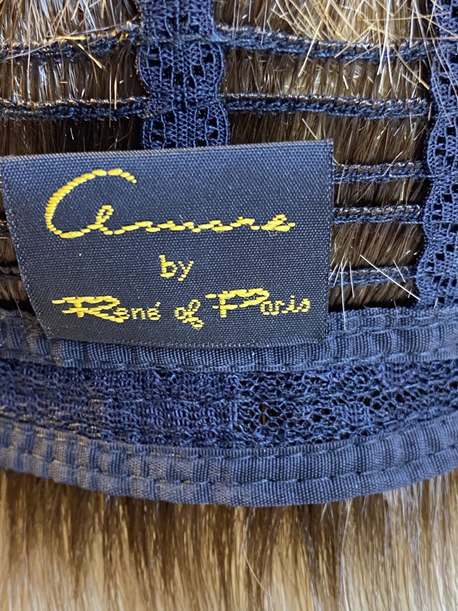 Rooted blonde/brown Rene of Paris wig. Brms477