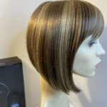 Stylish boxed Rene of Paris blonde wig. Bblms303