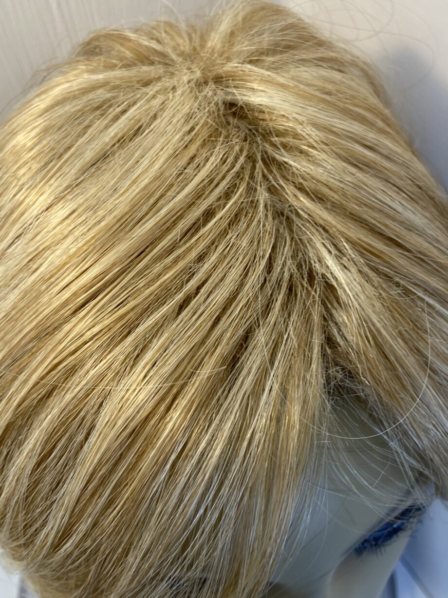 Soft shiny mid length blonde.  Blms99