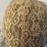 New tag on curly ash grey wig. Abmc95
