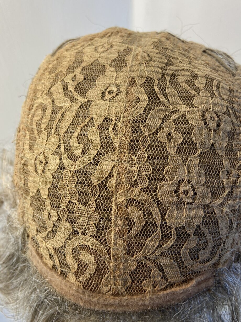 New tag on curly ash grey wig. Abmc95