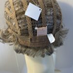 New tag on curly ash grey wig. Abmc95