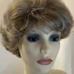 New tag on curly ash grey wig. Abmc95