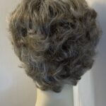 New tag on curly ash grey wig. Abmc95