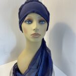 Dark blue turban with ribbons. 83