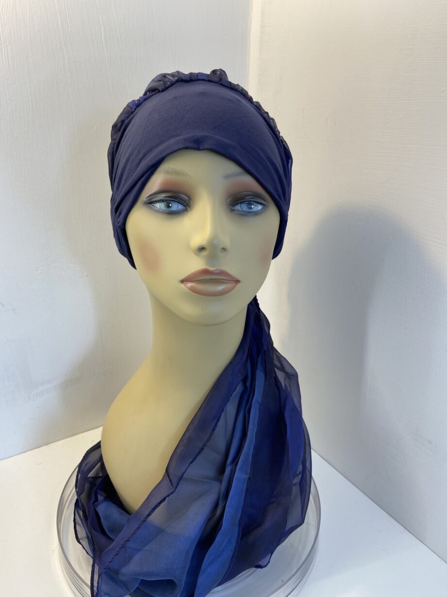 Dark blue turban with ribbons. 83
