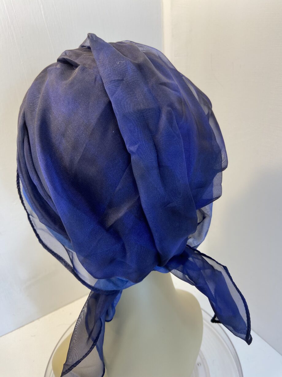 Dark blue turban with ribbons. 83
