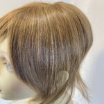 Brown hair piece. Brss730