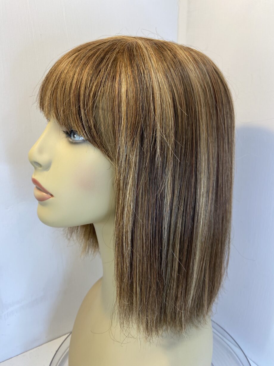 Blonde highlighted Rene of Paris wig. Brms216