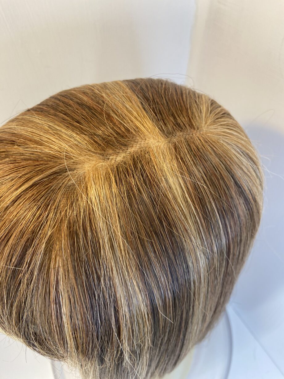 Blonde highlighted Rene of Paris wig. Brms216
