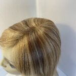 Highlighted honey blonde mid length wig. Blms526