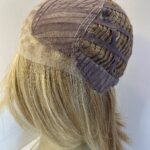 Highlighted honey blonde mid length wig. Blms526
