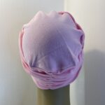 Pink headwear. 109