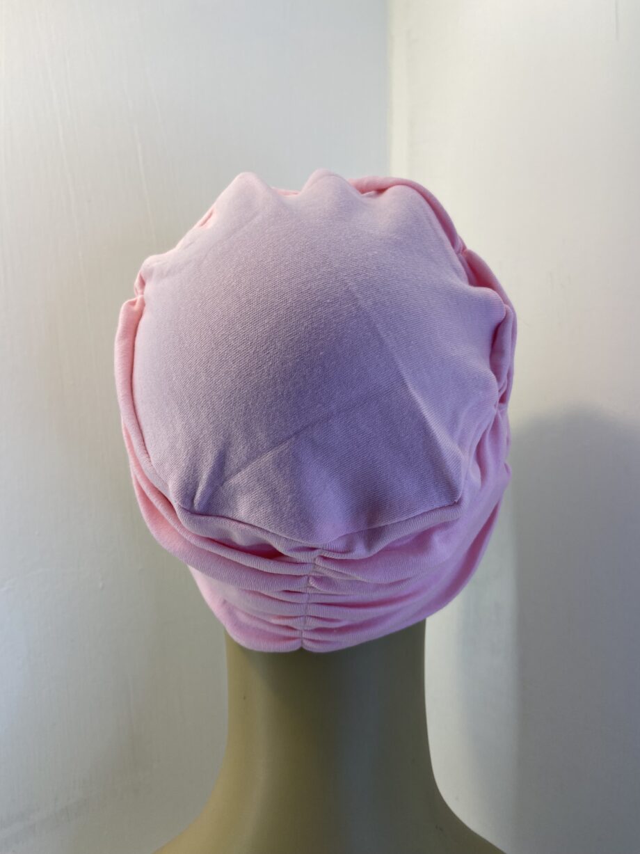 Pink headwear. 109