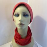 Red headwear and scarf. 112