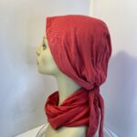 Red headwear and scarf. 112