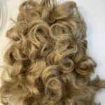 Blonde curly hair piece. 136