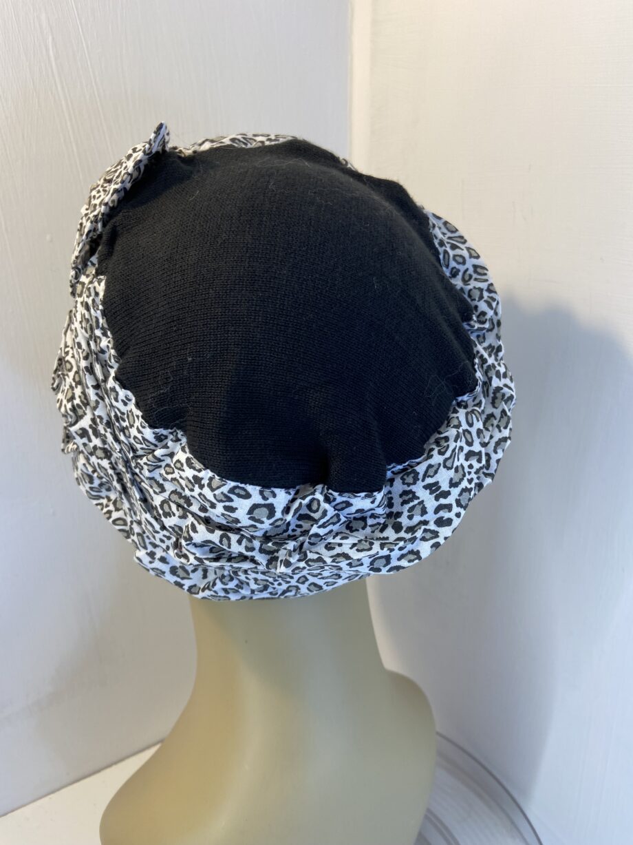 Black and white hat. 138