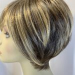 Boxed blonde Raquel Welch wig. Bblss492