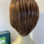 Judy plum as new reddish  brown boxed wig. Bbrms701